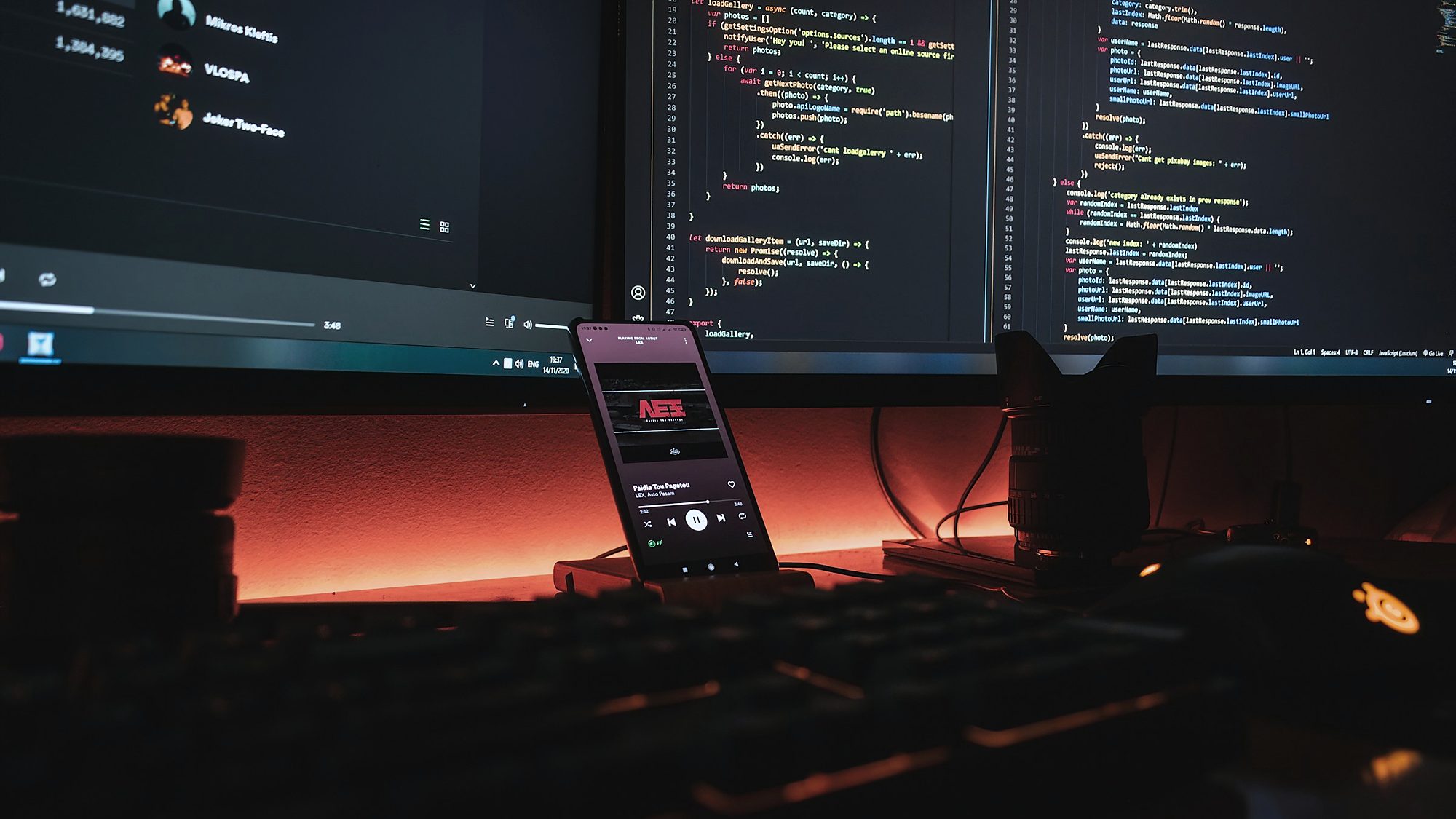 Code and a phone app running side by side on a developer desk